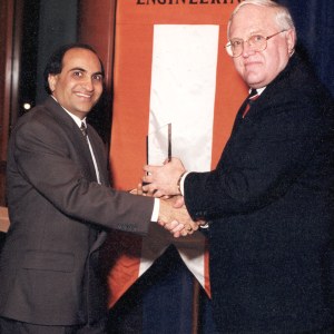 Dr. Dave receiving the award from Provost Van Buskirk