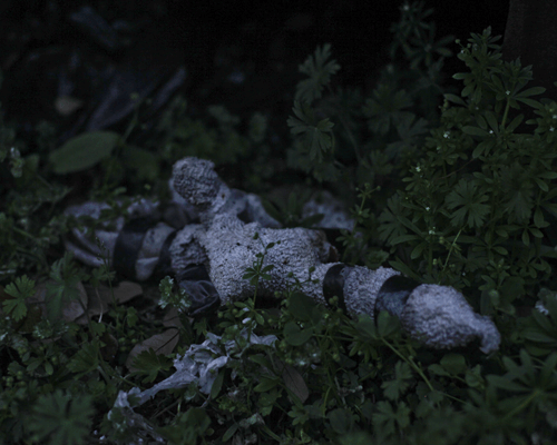 from a poor person cemetery in New Orleans, its a real Voodoo doll laying in the grass of an over grown grave